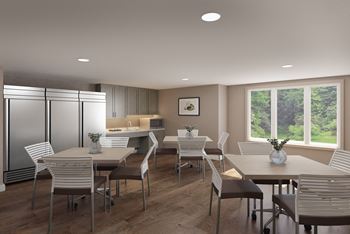 A modern dining room with a large table and chairs